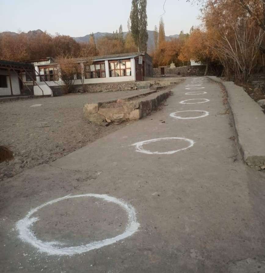 Circles have been made in front of a polling station to ensure safety of the voters in LAHDC Leh election