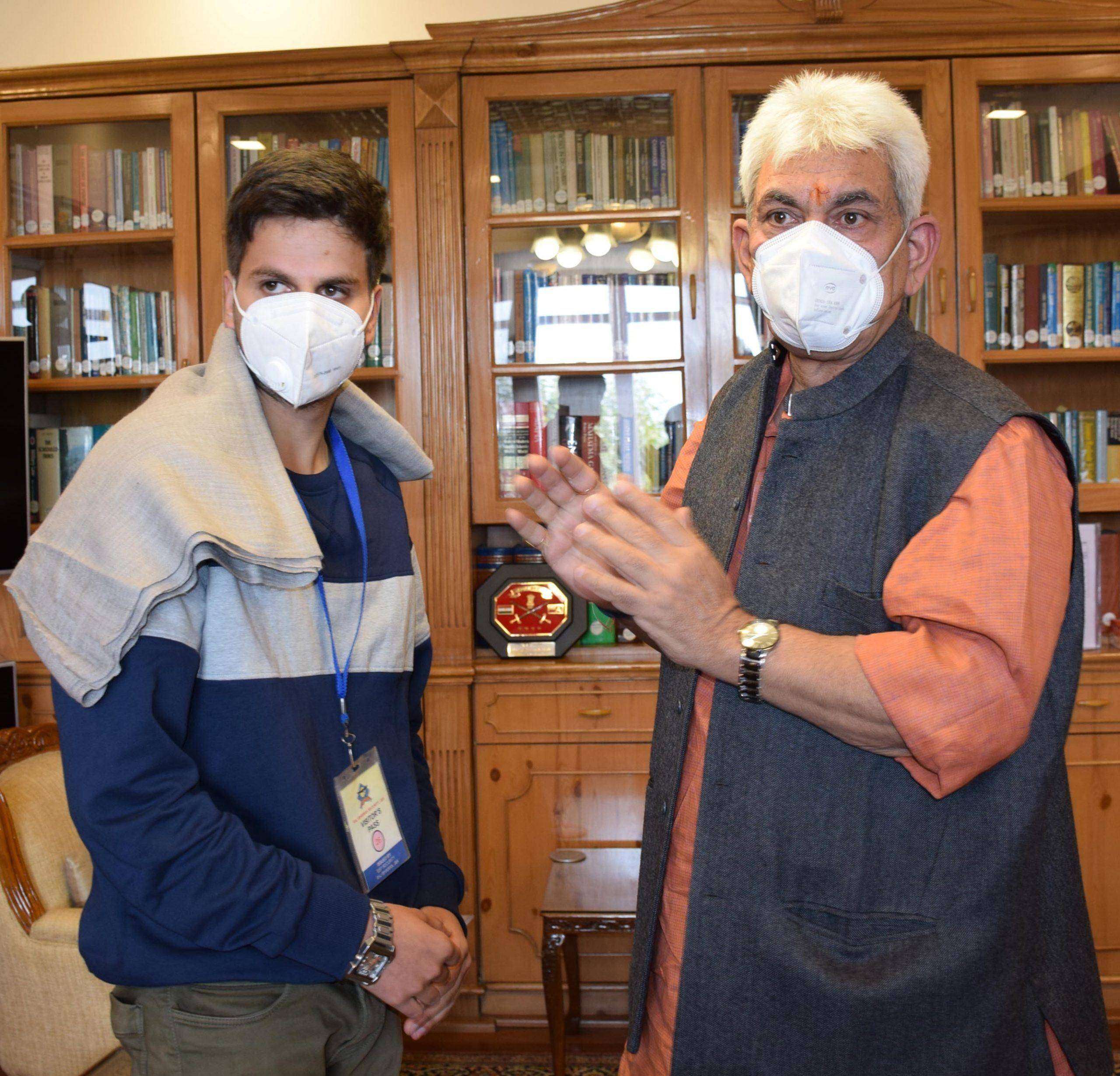 Manoj Sinha meets J&K NEET topper Basit Bilal Khan at the Raj Bhavan